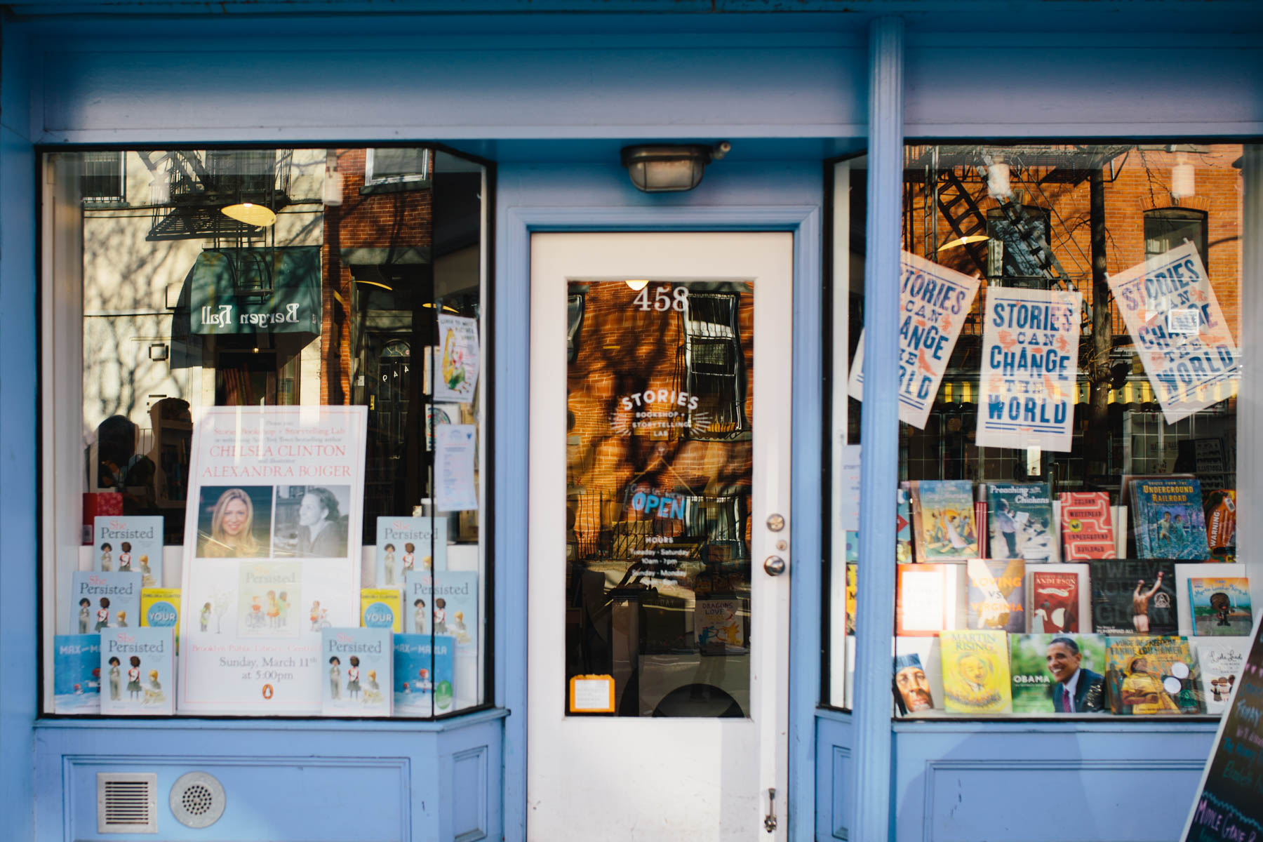 open sign on stories bookshop in brooklyn, ny